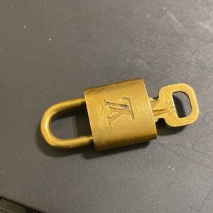 - Louis Vuitton Authentic Lock & Key # 323